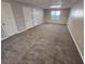 Large basement with neutral carpet and multiple doors at 5922 Graywood Cir, Mableton, GA 30126