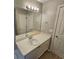 Bathroom features a vanity, large mirror, and decorative lighting at 5922 Graywood Cir, Mableton, GA 30126