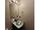 Powder room features a stylish mirror and vanity with sink at 5922 Graywood Cir, Mableton, GA 30126