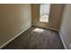 Bedroom bathed in natural light, featuring neutral carpeting and walls at 5922 Graywood Cir, Mableton, GA 30126