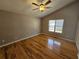 Sunlit bedroom with high ceiling, hardwood floors, and a ceiling fan at 5922 Graywood Cir, Mableton, GA 30126