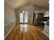 Dining area with high ceilings, a modern chandelier, and convenient access to the kitchen and backyard at 5922 Graywood Cir, Mableton, GA 30126