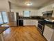 Bright kitchen features stainless steel appliances, granite counters, and an access to the outdoor area at 5922 Graywood Cir, Mableton, GA 30126
