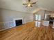 Open-concept living area with fireplace, hardwood floors, and seamless flow to the kitchen at 5922 Graywood Cir, Mableton, GA 30126