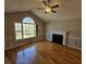 Bright living room with vaulted ceiling, a fireplace, and large windows for ample natural light at 5922 Graywood Cir, Mableton, GA 30126