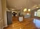 Open concept living area and kitchen featuring hardwood floors and a center island at 5922 Graywood Cir, Mableton, GA 30126