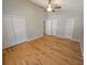Spacious primary bedroom featuring hardwood floors, ceiling fan, and closet space at 5922 Graywood Cir, Mableton, GA 30126