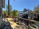 View of backyard deck with access to shed and wooded views, seating area on deck at 2220 Wellington Cir, Lithonia, GA 30058