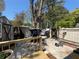 View of backyard deck with wooded views and access to shed and other yard features at 2220 Wellington Cir, Lithonia, GA 30058