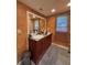 Bathroom featuring double sinks, granite countertop, and natural light from window at 2220 Wellington Cir, Lithonia, GA 30058