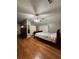 Spacious bedroom with hardwood floors, ceiling fan, and good natural light from the window at 2220 Wellington Cir, Lithonia, GA 30058