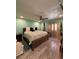 Bright bedroom boasts natural light, cozy decor, and comfortable furnishings at 2220 Wellington Cir, Lithonia, GA 30058