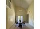 Bright dining room with vaulted ceiling, tile floors, chandelier, and access to a patio at 2220 Wellington Cir, Lithonia, GA 30058
