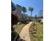 Well-manicured front yard with landscaping beds and a walkway leading to the entrance at 2220 Wellington Cir, Lithonia, GA 30058