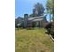 Charming one-story home with a well-maintained lawn, landscaping, and a cozy front entrance at 2220 Wellington Cir, Lithonia, GA 30058