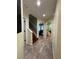 Hallway featuring stairs to the upper level and doorways to other rooms in the home at 2220 Wellington Cir, Lithonia, GA 30058