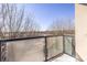 Balcony featuring a glass railing with views of nearby trees at 335 W Ponce De Leon Ave # 506, Decatur, GA 30030