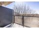 Apartment balcony featuring a glass railing with views of nearby trees at 335 W Ponce De Leon Ave # 506, Decatur, GA 30030