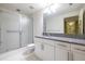 Bathroom features granite vanity, large mirror and glass-enclosed shower at 335 W Ponce De Leon Ave # 506, Decatur, GA 30030