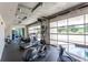 Bright gym area with various exercise machines and natural light from large windows at 335 W Ponce De Leon Ave # 506, Decatur, GA 30030
