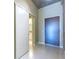 Hallway view showcasing a sliding door entrance to an adjacent bathroom at 335 W Ponce De Leon Ave # 506, Decatur, GA 30030