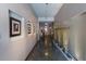 Hallway featuring artwork, decorative reeds, and an elevator in the background at 335 W Ponce De Leon Ave # 506, Decatur, GA 30030
