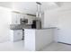 Bright kitchen with stainless steel appliances, white cabinets, and stylish backsplash at 335 W Ponce De Leon Ave # 506, Decatur, GA 30030