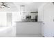 Open-concept kitchen featuring white cabinets, stainless steel appliances, and bar-style seating at 335 W Ponce De Leon Ave # 506, Decatur, GA 30030