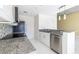 Granite countertops complement the stainless steel appliances in this modern kitchen at 335 W Ponce De Leon Ave # 506, Decatur, GA 30030