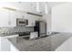 The modern kitchen features stainless steel appliances and sleek cabinetry at 335 W Ponce De Leon Ave # 506, Decatur, GA 30030
