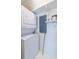 Efficient laundry room with stacked washer and dryer and convenient shelving at 335 W Ponce De Leon Ave # 506, Decatur, GA 30030