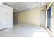 Open living space with a concrete ceiling, neutral walls, and a sliding glass door at 335 W Ponce De Leon Ave # 506, Decatur, GA 30030
