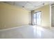 Bright living area featuring concrete ceiling, neutral walls, and a sliding glass door at 335 W Ponce De Leon Ave # 506, Decatur, GA 30030
