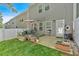 Backyard patio leads to grassy lawn with privacy fence, offering a great space for outdoor enjoyment at 485 Crescent Woode Dr, Dallas, GA 30157
