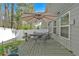 Backyard deck features an outdoor table with chairs, umbrella, and white privacy fence at 485 Crescent Woode Dr, Dallas, GA 30157