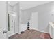 Bright bathroom featuring a bathtub, stand-up shower, and wooden floors at 485 Crescent Woode Dr, Dallas, GA 30157