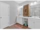 Bathroom with double sink vanity with a dark wooden cabinet and a mirror at 485 Crescent Woode Dr, Dallas, GA 30157