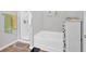 Bathroom with a stand-up shower, and a soaking tub near a white cabinet at 485 Crescent Woode Dr, Dallas, GA 30157