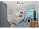 Cozy bedroom featuring a ceiling fan, a blue accent rug, and a stylish gray wardrobe at 485 Crescent Woode Dr, Dallas, GA 30157