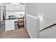 A built-in desk area features white cabinets, a printer, and a brown chair near stairs at 485 Crescent Woode Dr, Dallas, GA 30157