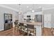 Modern kitchen with white cabinetry, stainless steel appliances and granite island at 485 Crescent Woode Dr, Dallas, GA 30157