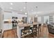Bright kitchen features a granite countertop island with seating at 485 Crescent Woode Dr, Dallas, GA 30157
