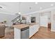 Granite countertop island with sink overlooks the Gathering room at 485 Crescent Woode Dr, Dallas, GA 30157