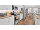 Kitchen showcasing stainless steel appliances, granite countertop, and white subway tile backsplash at 485 Crescent Woode Dr, Dallas, GA 30157