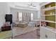 Spacious main bedroom with sitting area, ceiling fan, and natural light at 485 Crescent Woode Dr, Dallas, GA 30157