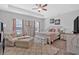 A primary suite featuring a seating area, decor, and a ceiling fan at 485 Crescent Woode Dr, Dallas, GA 30157