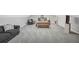 Open basement bedroom area featuring soft carpet and a relaxing sofa seating area at 718 Fincher Rd, Covington, GA 30016