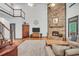 Stunning living room featuring a soaring fireplace and hardwood floors at 718 Fincher Rd, Covington, GA 30016