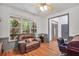 Office area with comfortable seating, wood floors, and natural lighting at 718 Fincher Rd, Covington, GA 30016