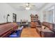Living room with wood floors, plenty of light, and comfortable seating at 718 Fincher Rd, Covington, GA 30016